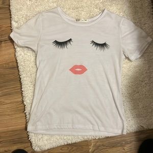 Graphic T shirt in size small. 👀🫦